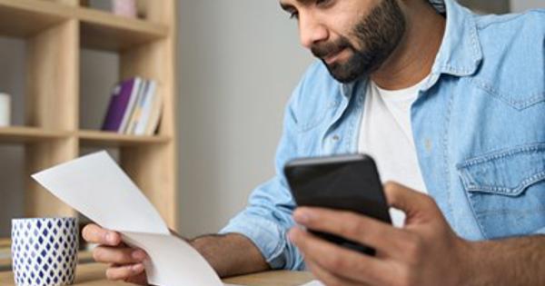 Indian Man Checking Details - stock